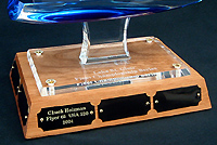 Laser engraving is performed under the acrylic base. The plate is laser engraved black brass.